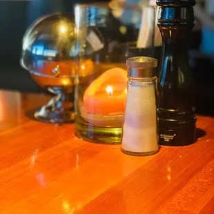 salt and pepper shakers on a wooden table