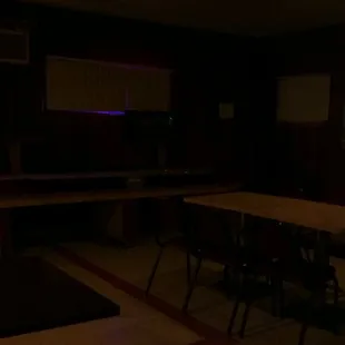 Table, with some chairs. Welcome to the Hilltop bar.