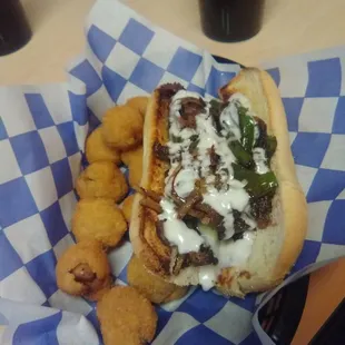 Cheesesteak sandwich with fries mushrooms