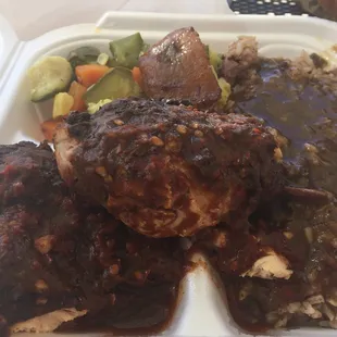 Jerk chicken lunch special with oxtail gravy on the rice