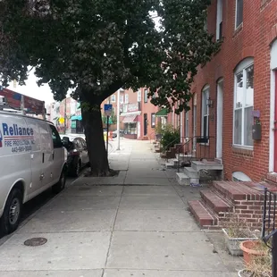 a van parked on the sidewalk