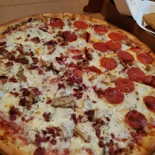 a pepperoni pizza in a box