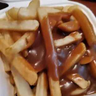a container of french fries and gravy