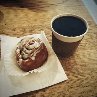 Coffee with cinnamon roll.
