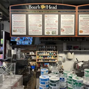 menus on the wall of the deli counter