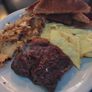 Rib Eye steak, eggs, hash browns and toast