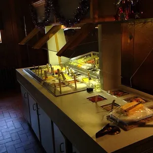 1980&apos;s salad bar with big block of cheddar