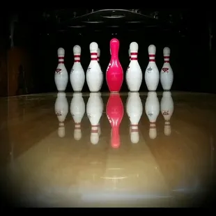 a bowling ball and pins in a bowling alley
