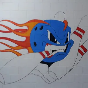 a bowling ball with flames coming out of it