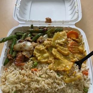 a take out container with rice and vegetables