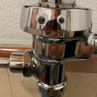 a close up of a chrome toilet