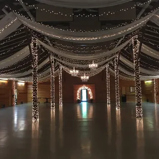 Fabric draping and chandeliers done by Kevin Griffin.