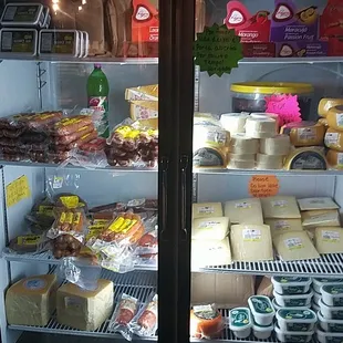 a refrigerated display of cheese