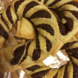 a pile of chocolate and cream pastries