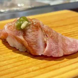  piece of sushi on a cutting board