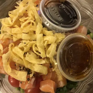 Lomi Lomi Salmon Poke Bowl. Crispy little wanton chips. Sauces were  . Nice amount of fresh salmon bits.