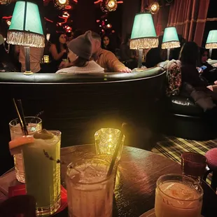 a group of people sitting at a bar