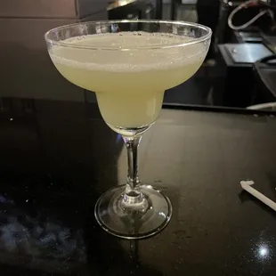  a cocktail in a coupe glass