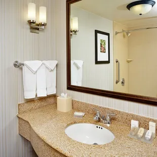 Guest bathrooms feature granite counter tops, fresh towels and complimentary toiletries.