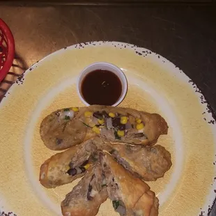 Our hand rolled tavern rolls complete with black bean corn salsa, house smoked pork, smoked gouda and BBQ sauce to dip
