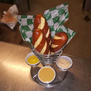 Pretzel rolls with our house beer cheese, yellow mustard and house horseradish Dijon mustard