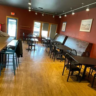 an empty restaurant with tables and chairs