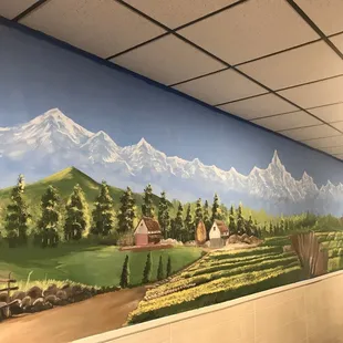 a mural of a mountain scene