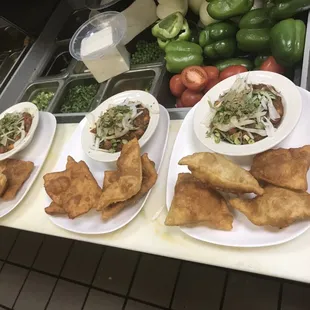 three plates of food on a counter