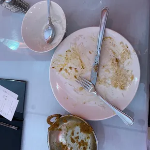 a plate of food left on a table