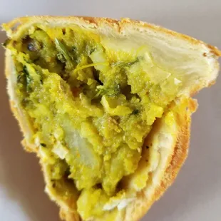 Inside a cut Samosa. Note the abundant filling and thin crust