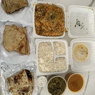 Himalayan biryani, chicken, tikka masala, palak paneer, and three different kinds on naan/bread. Garlic, paratha, aloo (potato) paratha