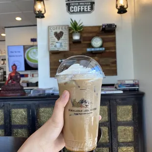 Iced honey latte with a cute background view