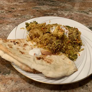 My serve of Plain Naan Bread and Himalayan Biryani tasted really good !