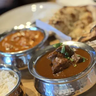 Goat curry, and butter chicken (behind).
