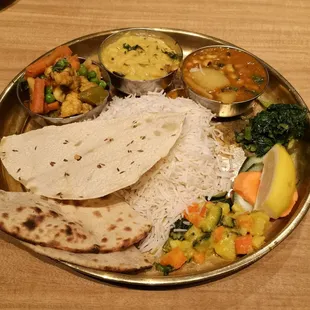 Veg Nepali Thali - Vegan - $15.99 - mix veg, yellow lentils, black eyed peas + potato, rice, bread, greens/salad, papad