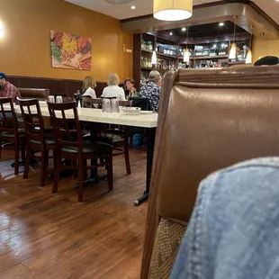 people sitting at tables in a restaurant