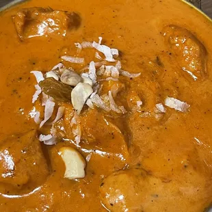 CHICKEN KORMA (boneless chicken curry with coconut, cashews, raisins, in a coconut milk Himalayan sauce) with basmati rice on the side