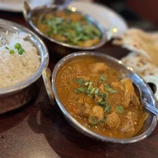 three bowls of food on a table