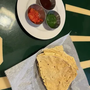 Complimentary lentil flatbread with variety of chutneys
