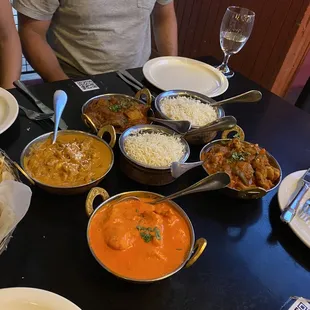 Clockwise from bottom:  chicken tikka masala, chicken kadai, chicken vindaloo, chicken korma