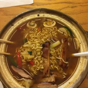 a bowl of ramen and chopsticks