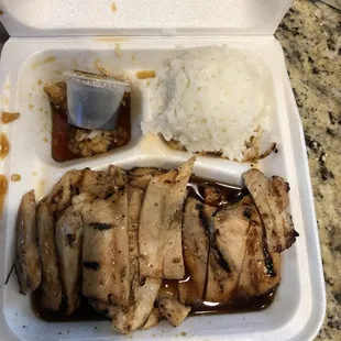 chicken and rice in a styrofoam container