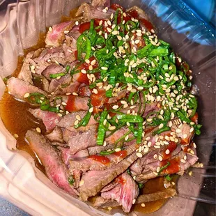a close up of a beef dish