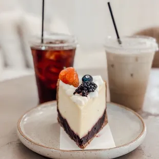 The berry cheesecake, an orange blossom latte (decaf) and black coffee.