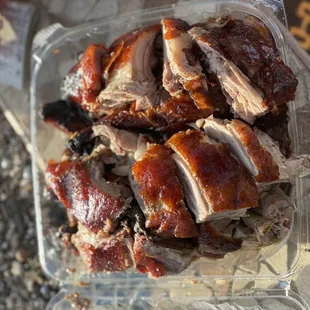 a plastic container with meat in it