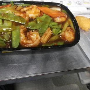 Shrimp with peapods; a fried shrimp on the side.