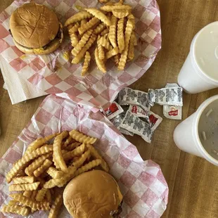 two burgers and french fries