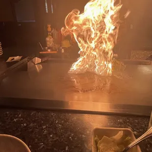 a fire in the middle of a grill