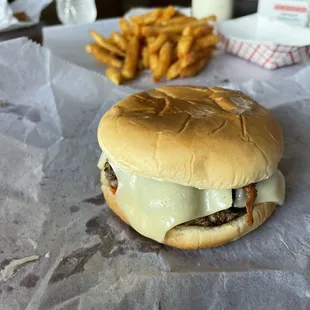 Mushroom Bacon Swiss Burger with a side of fries.
