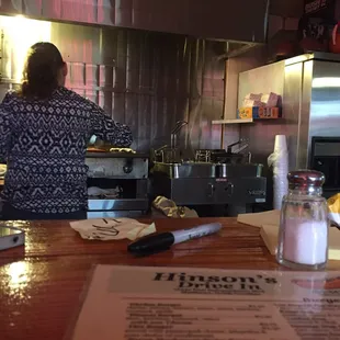 This is their entire kitchen set up, directly behind the bar.